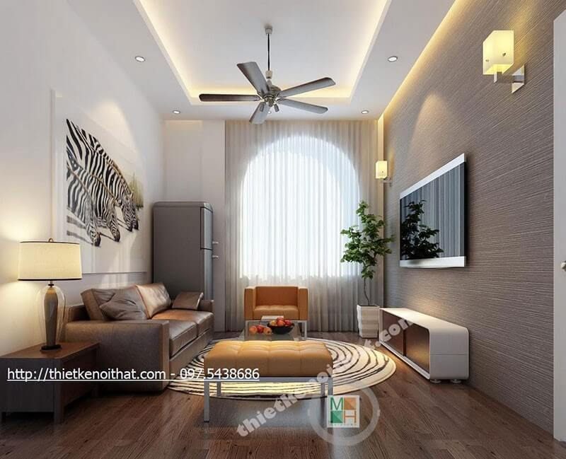 .
Để làm cho bức tường không còn bị thô cứng mà lại tạo được điểm nhấn cho phòng khách, hãy sử dụng tranh treo tường và giấy dán tường màu xám.